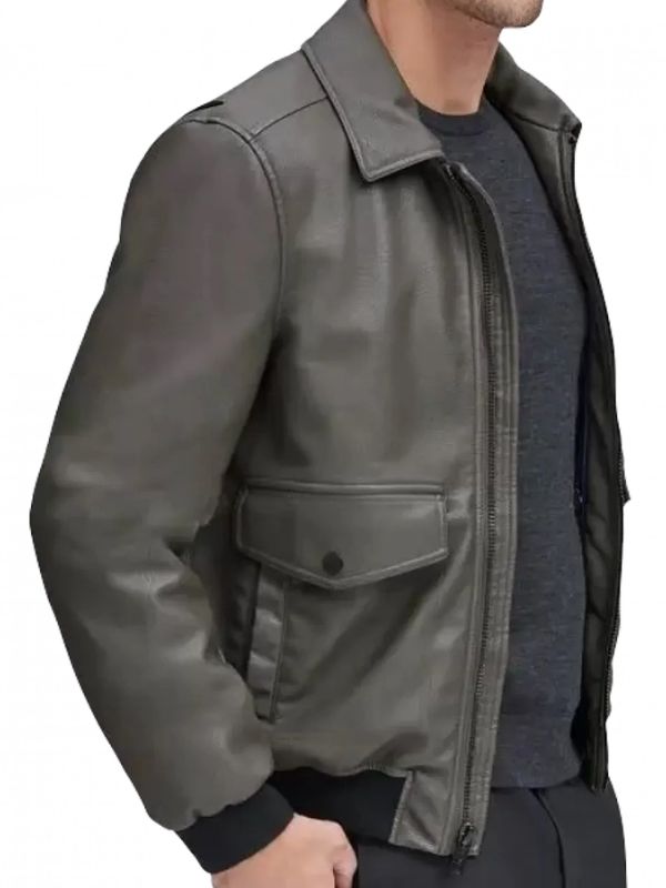 Gray leather jacket worn by a person on a white background