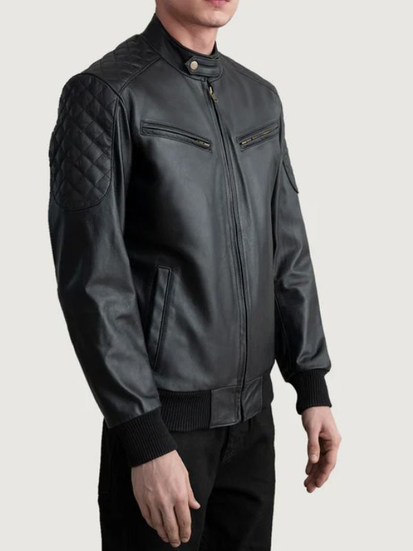 Black leather jacket worn by a person on a light gray background