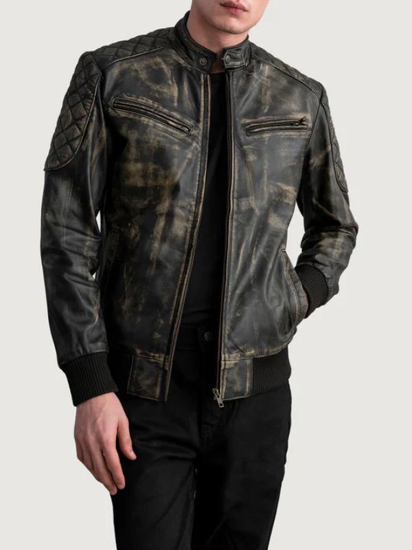 Man wearing a distressed black leather jacket on a light gray background